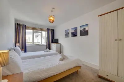 a bedroom with two beds and a window at 3 Bed in St Ives oc-weshs in St Ives