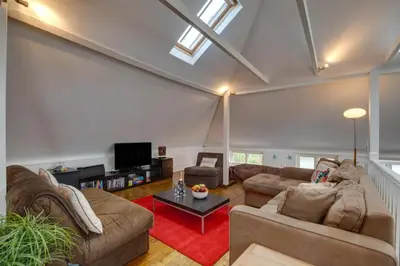 a living room with two couches and a tv at 3 Bed in St Ives oc-weshs in St Ives