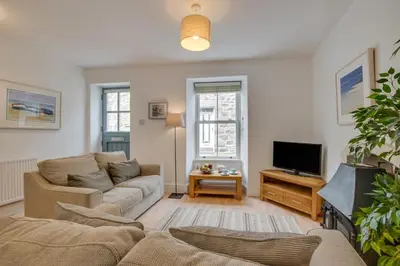 a living room with a couch and a tv at 2 Bed in St Ives oc-wyp026 in St Ives