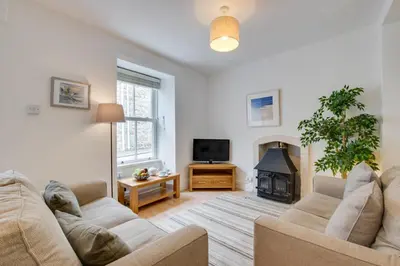 a living room with two couches and a fireplace at 2 Bed in St Ives oc-wyp026 in St Ives