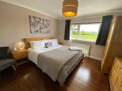 a small bedroom with a bed and a window at Ashlea in Launceston