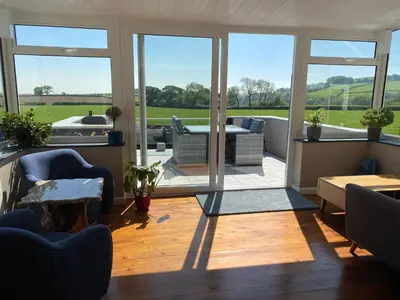 a living room with a view of a patio at Ashlea in Launceston