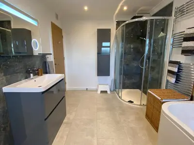 a bathroom with a shower and a sink and a tub at Ashlea in Launceston