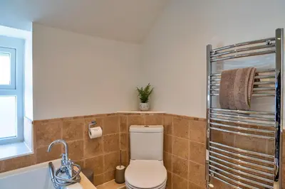 a bathroom with a toilet and a sink at Finest Retreats - Trethew Cottage in Carnbrea