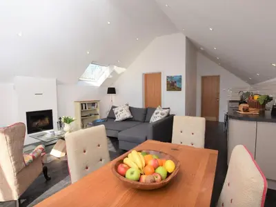 a living room with a bowl of fruit on a table at Fernsplatt Farm Lodge in Truro