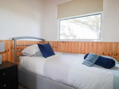 two beds in a room with a window at 194 Atlantic Bays in Padstow