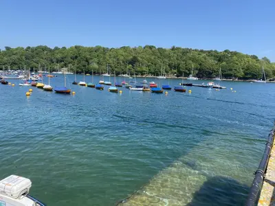 a bunch of boats are docked in the water at 5 mins from the Eden Project Baybreeze Holiday Apartment, Sea Views, Super Kingsize Beds in St Austell