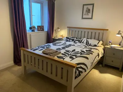 a zebra print bed in a bedroom with a window at Bodmin Rest 4 U in Bodmin