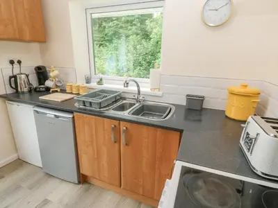 a kitchen with a sink and a window at 11 Tremore in Liskeard