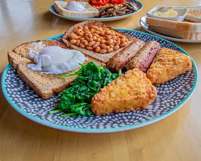 a blue and white plate of food on a table at Wayfarers Inn in Penzance