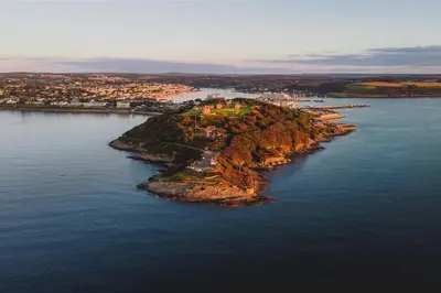 an island in the middle of a body of water at The Nest, Central Falmouth, 10 mins to the beaches and off street parking in Falmouth