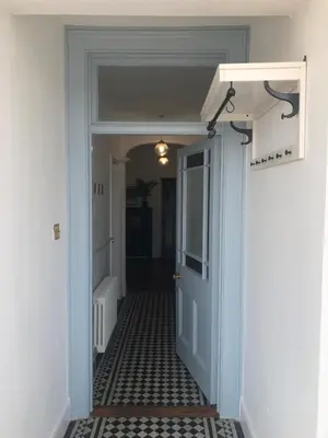 an open door to a hallway with a hallwayngth at The Nest, Central Falmouth, 10 mins to the beaches and off street parking in Falmouth
