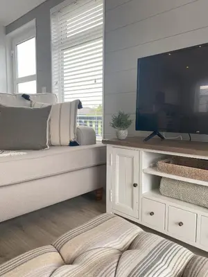 a bedroom with a large television and a bed at No14 Padstow in Padstow