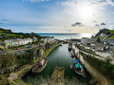 a group of boats are docked in a river at Holiday Home Sea Breeze by Interhome in St Austell