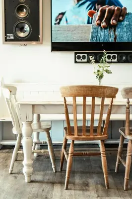a dining room with a white table and chairs at Glamping at Macdonald's Farm in Saint Ervan