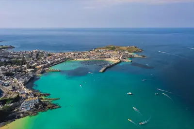 an aerial view of a small island in the water at Island Studio with on-site parking in St Ives
