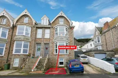 a building with a parking bay sign in front of it at Island Studio with on-site parking in St Ives