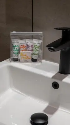 a bathroom sink with a container on top of it at The Potting Barn in Saint Ervan
