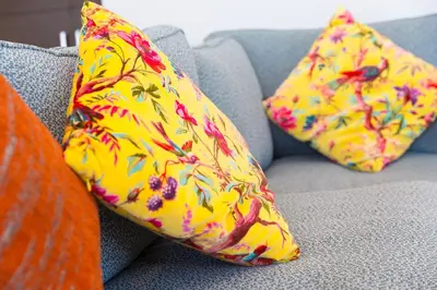 two pillows sitting on a couch with at Bay View in St Ives