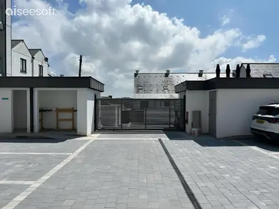 a parking lot with a gate on top of a building at Beachside Apartment in Newquay
