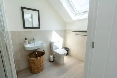 a bathroom with a toilet and a sink at The Bright House, St Eval - near Padstow, Mawgan Porth, Watergate, Bedruthan & Porthcothan in Saint Ervan