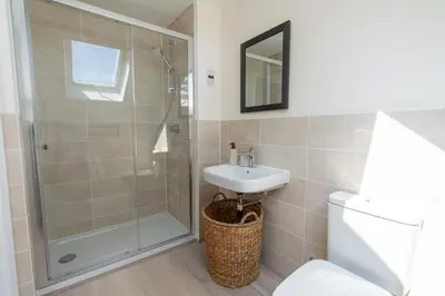 a bathroom with a shower and a sink at The Bright House, St Eval - near Padstow, Mawgan Porth, Watergate, Bedruthan & Porthcothan in Saint Ervan