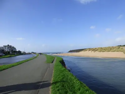 a road next to a beach next to a body of water at Shepherds Retreat in Launceston