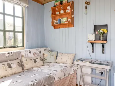 a living room with a couch and a table at Shepherds Retreat in Launceston
