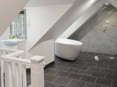 a bathroom with a sink and a bath tub at Gumburnville in Lanteglos
