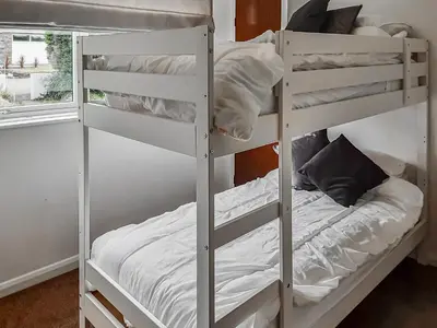 a couple of bunk beds in a room at Valley Truckle Bungalow in Camelford