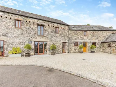 a large stone house with a large courtyard at What A Beauty - Thr in Tresmeer