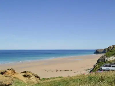 a view of a beach with people on it at Porth View in Saint Mawgan
