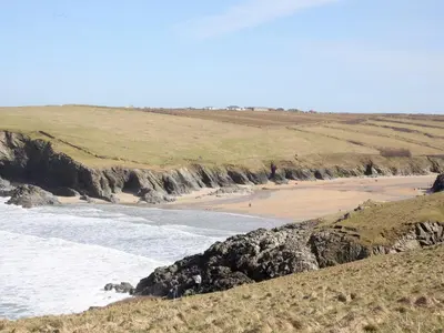 a view of a beach with people walking on the sand at Manor Cottage in Crantock