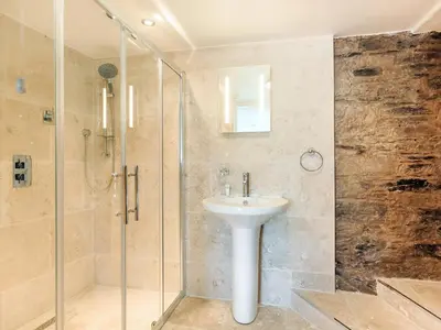 a bathroom with a sink and a shower at Manor House in Crantock