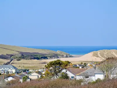 a small town with houses and the beach at The Old Butchers in Crantock