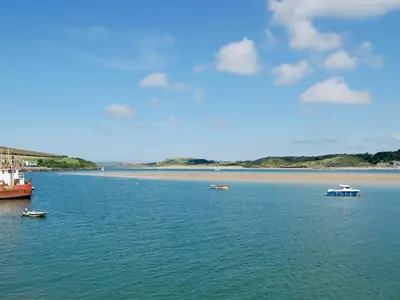 a large body of water with boats in it at Creekside in Little Petherick