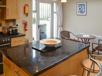 a kitchen with a bowl on top of a counter at Sandpipers in Padstow