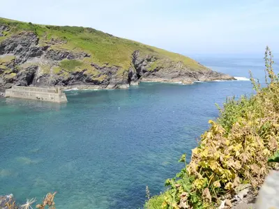 a view of a body of water with an island at Lower Moon in Port Isaac