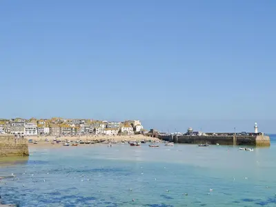 a view of a beach with boats in the water at The Farm House in Porkellis