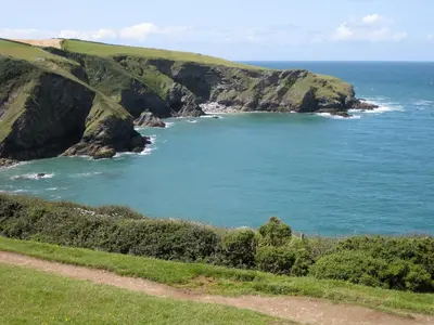 a view of the ocean from a hill at Dove Cottage in Lezant