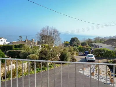 a view of a street with a car on the road at Ponsgwedhen in Coverack