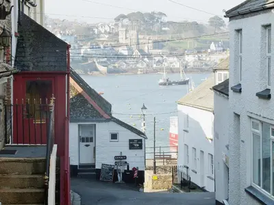 a view of a harbor with a boat in the water at Fairmaiden in Polruan