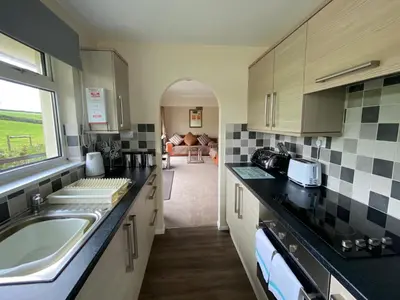 a kitchen with a sink and a counter top at Cotehele - B6524 in Saint Cleer