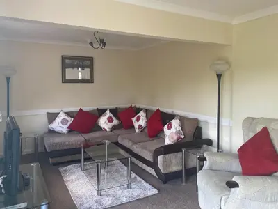 a living room with a couch with red and white pillows at Eden - B6526 in Saint Cleer