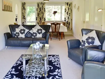 a living room with two leather couches and a table at Trevarno - B6527 in Saint Cleer
