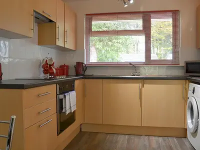 a kitchen with a sink and a dishwasher at Seaton in Saint Cleer