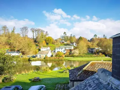 a view of a village with a lake at Florin Cottage in Lerryn