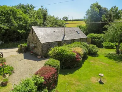 an overhead view of a garden with a building at Trenay Barns Cottage in Warleggan