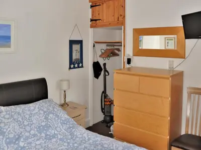 a bedroom with a dresser and a bed and a dresser at Sea Haven - Tho in Gorran Haven