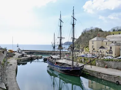 a boat is docked in the water in a harbor at Millie's Place in Saint Stephen